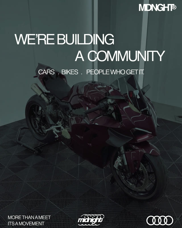 A poster for MDNGHT: a deep red sports bike in a dim garage under the headline WE ARE BUILDING A COMMUNITY.